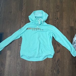 Mint green under armour hoodie with camo logo